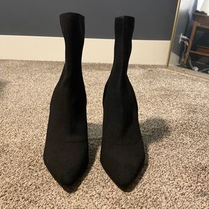 Black high heel boots, size 8.